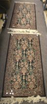 A pair of Persian style wool rugs.