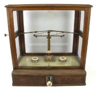 A cased set of apothecary scales by Dertling, London.