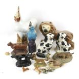 An assortment of resin and ceramic model animals.