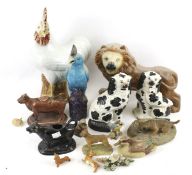 An assortment of resin and ceramic model animals.
