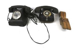 Two vintage telephones and a wooden jack.