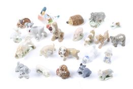 A collection of miniature ceramic animals. Including Wade Whimsies, Beswick, etc.