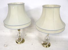 A pair of crystal and brass lamps, complete with shades and shade gimbles.