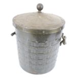 A vintage cast metal coal bin.