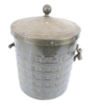 A vintage cast metal coal bin.