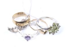 Five silver and yellow metal dress rings. Including one set with an amethyst stone, etc.