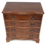 A contemporary sepentine fronted chest of drawers.