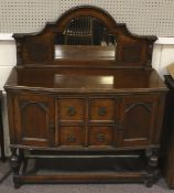 A 19th century style oak sideboard.