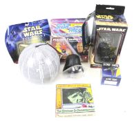 An assortment of Star Wars and Star Trek collectables.