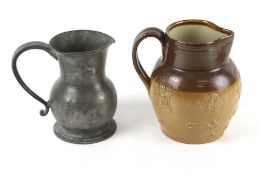 A vintage Royal Doulton stoneware jug and a pewter jug.