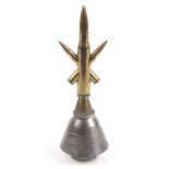 A piece of Trench Art with bullets inserted to form a star mounted on a part MK 149 rocket base.