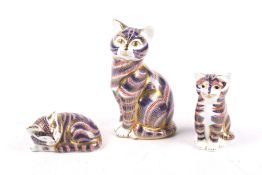 Three Royal Crown Derby figures of cats.