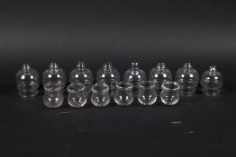 A group of eight and six glass cupping cups. The first set with knob finials. Max circa H8.