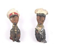 A pair of early 20th century miniature naval figures.