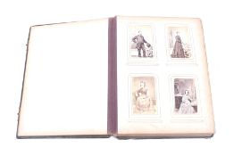 A 19th century photograph album filled with family portraits. In a moulded green leather cover.