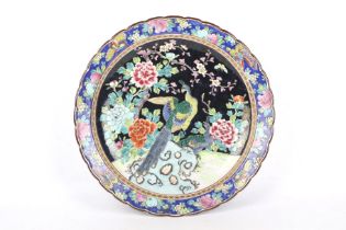 A large 20th century Japanese charger with fluted rim and decorated with pheasants and peonies.