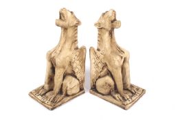 Pair of ceramic bookends in the form of winged lions. H29.