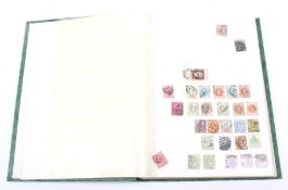 A stock book of Great Britain early to 1960s stamps.