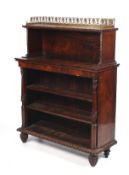 A Regency rosewood and inlaid brass bookcase of two parts.
