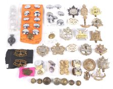 A collection of cap badges and buttons.