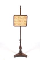 A 19th century mahogany pole screen.