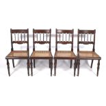 A set of four Regency mahogany and rosewood dining chairs.