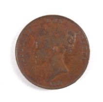 An 1853 penny coin