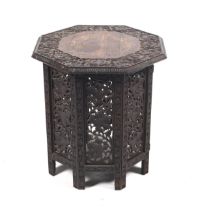 An Anglo Indian carved folding octagonal table.