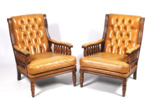 A pair of late Victorian style leather button back style armchairs with tan coloured leather