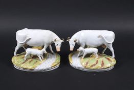 Staffordshire : A pair of handed cows and calves on naturalistic bases. Each circa H18.