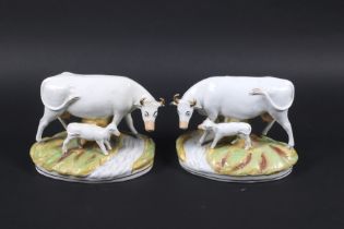 Staffordshire : A pair of handed cows and calves on naturalistic bases. Each circa H18.