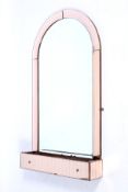 Art Deco : An original peach glass surround bevelled and arched wall mirror.
