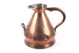 A large Victorian copper harvest jug with two handles and LCC measures stamp.
