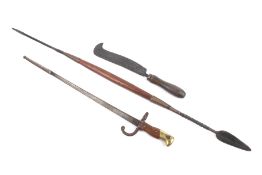 A bayonet (made safe), a spear and a bill hook knife.