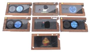 A collection of seven magic lantern slipper slides.