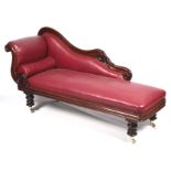 A William IV mahogany show-wood chaise longue with carved scroll and acanthus decoration.