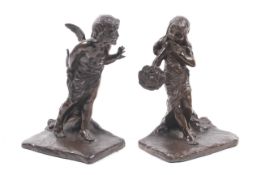 A pair of bronze bookends sculpted by Peinlich M.