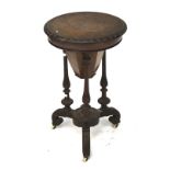 Victorian figured walnut ladies circular work table/sewing box.