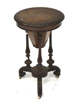 Victorian figured walnut ladies circular work table/sewing box.