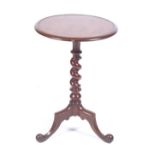 A Victorian mahogany wine table with circular top over a turned support on a tripod base. H44cm.