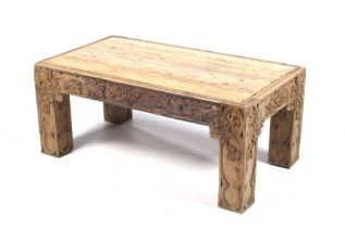 An Italian style wooden coffee table with inset polished stone top.
