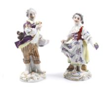 Meissen : A pair of hand painted ceramic figures of a young gardener and a girl.