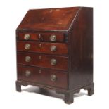 A Georgian mahogany bureau (circa 1805).