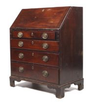 A Georgian mahogany bureau (circa 1805).