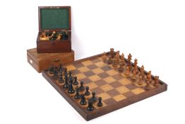 Chess : Two complete carved wood chess sets together with a walnut and maple ? chequer/chess board,