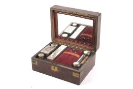 A late 19th century campaign brass bound walnut travelling vanity case.