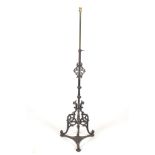 An adjustable standard lamp with a 19th century cast iron base. Photographed height 150cm.