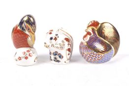 Three Royal Crown Derby figures of a squirrel (LVI), kingfisher (LVIII) and chicken (LVI). Max H11.
