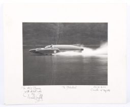 A black and white photograph of 'The Bluebird' signed by Donald Campbell, mounted on white card.