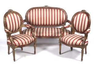 A 20th century French carved and gilded Regency stripe upholstered suite.